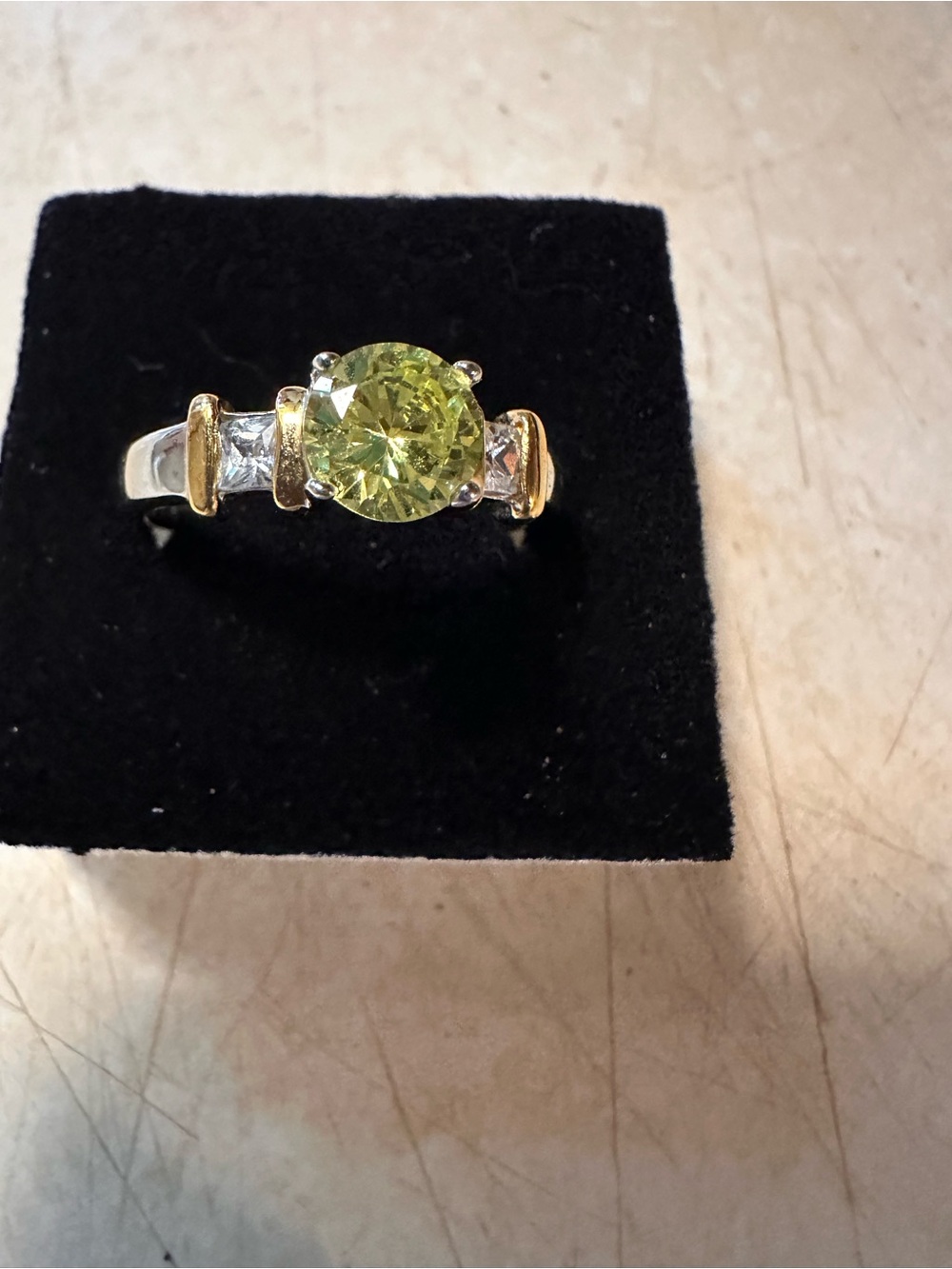 Yellow Gemstone Ring with Goldtone rings around the Silvertone band